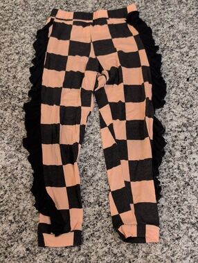 Girls Peach & Black Checkerboard Ruffle Leggings